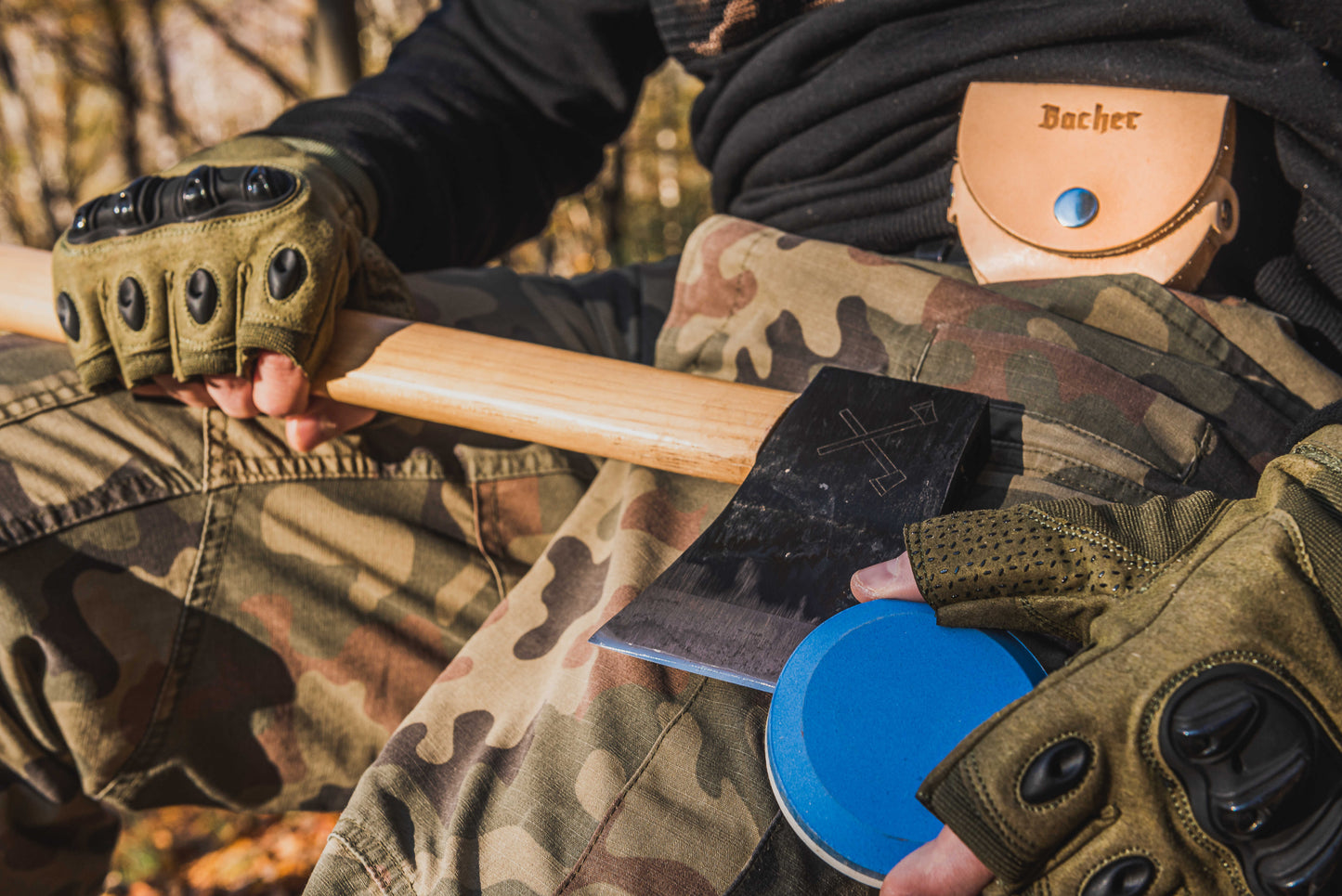 Axe sharpening stone with a leather pouch