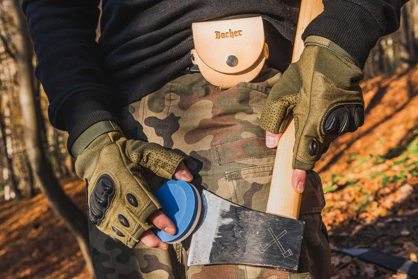 Axe sharpening stone with a leather pouch