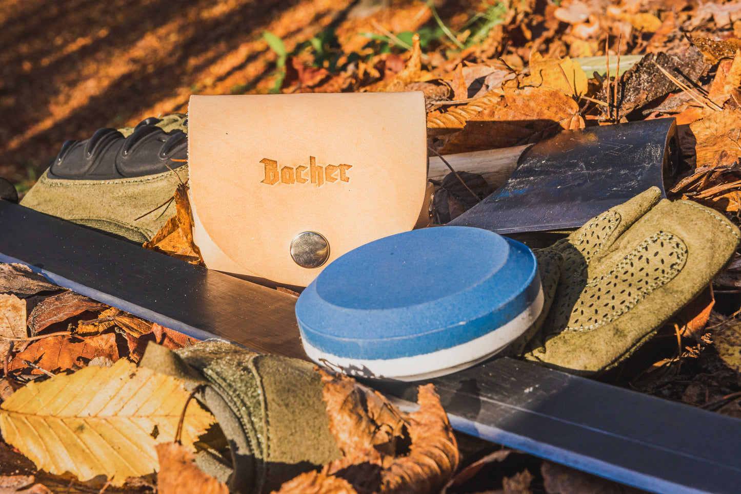 Axe sharpening stone with a leather pouch