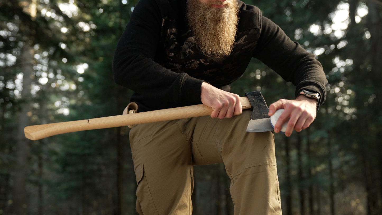 Axe sharpening stone with a leather pouch